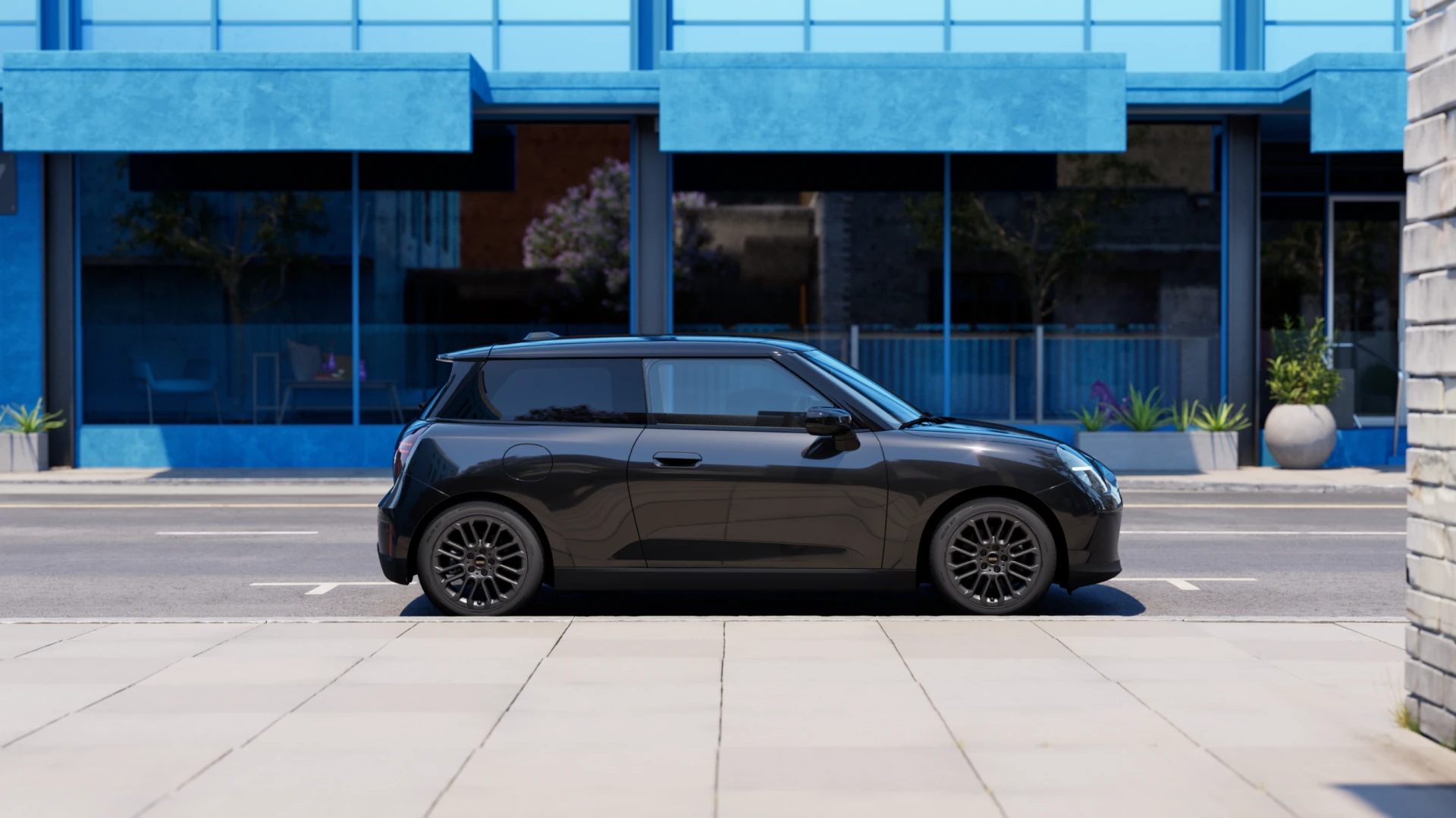 All-Electric MINI Cooper in Midnight Black II parked on a city street.